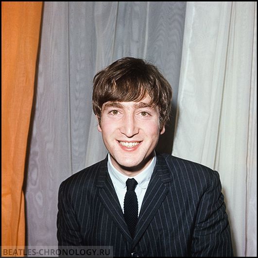 English musician and guitarist with The Beatles, John Lennon (1940-1980), pictured backstage wearing a pin striped jacket at a concert venue in England in 1964. (Photo by Rolls Press/Popperfoto/Getty Images)