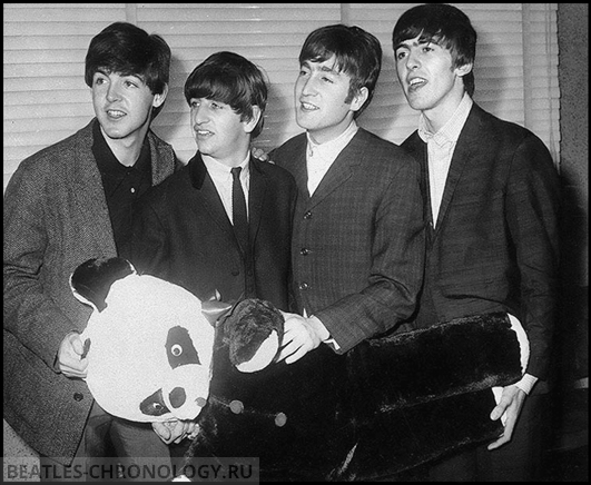 The Beatles, from left, Paul McCartney, Ringo Starr, John Lennon and George Harrison, hold a toy panda presented to them by fans in Manchester, England, in this November 1963 photo. (AP Photo)