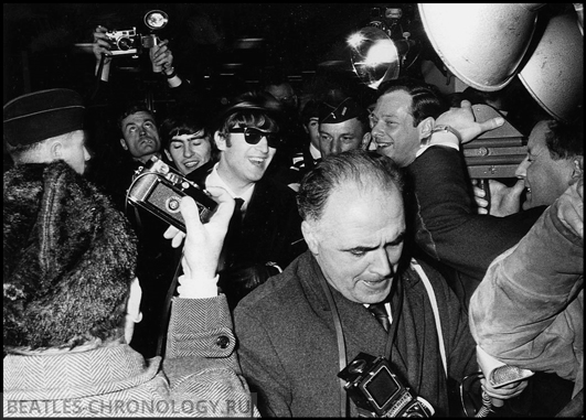 Volume 2, Page 85, Picture 3. The Beatles, Paris, France. January 1964. George Harrison and John Lennon with Manager Brian Epstein.